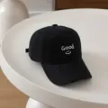 Detailed shot of a black children's baseball hat with white embroidery Good and a cute smile. - 54cm Adjustable For 6-12 Years / Smile Good Black
