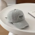 Close-up detail of the gray distressed kids baseball cap with embroidered letter and cute smiley. - 54cm Adjustable For 6-12 Years / Smile Good Matcha Green