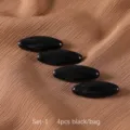 Vista detallada de imperdibles magnéticos negros para hijab, forma ovalada, set de cuatro. - Grupo 1 negro 4 piezas