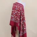 Detailed view of the red embroidered cashmere-feel shawl with exquisite floral and leaf patterns. - Burgundy