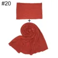 Solid color modal cotton scarf and undercap combination detail view, soft fabric texture. - Brick Red