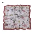Detail shot of a large floral square scarf with elegant wavy cut edges and pink border. - Pattern #1