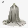 Detailed view of solid color crinkled cotton scarf with delicate tassel fringe edges. - Size 7