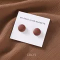 Round matte magnetic hijab pins scarf clips in a set of two, detailed close-up shot. - COL.15 Caramel