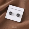 Detailed close-up of matte dark grey magnetic hijab pins displayed on white card. - COL.24 Dark Gray