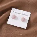 Close up of matte finish round magnetic hijab pins set in neutral brown fabric background. - COL.40 Red