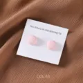 Close-up view of matte pink round magnetic hijab pins on backing card, detailed accessory shot. - COL.43 Pink