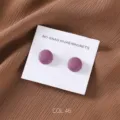 Detail shot of matte purple round magnetic hijab pins displayed neatly on white card. - COL.46 Purple