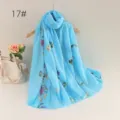 Detailed view of the light blue floral embroidered linen scarf, showing exquisite stitching. - 17#