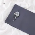 Detailed close-up of dark grey chiffon scarf with handmade crystal rhinestone flower embellishment. - 2# / 1.8m