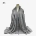 Grey crinkled hijab shawl scarf detailed view, featuring soft texture and stylish fringed edges. - Style #8