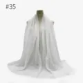 Close-up view of white TR cotton crinkle scarf showing soft texture and frayed edges. - #35