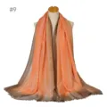 Gradient metallic silver silk scarf detail showing elegant color transition and soft fringes. - 9