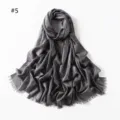 Close-up detail of grey shimmering viscose scarf with metallic threads and short fringe ends. - Dark Gray