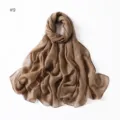 Detail view of the elegant brown glitter viscose scarf, showing soft fabric texture and shimmer. - Size 9