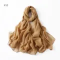Shimmering gold glitter detail on lightweight sheer fabric, elegant textured wrap close-up. - 10#