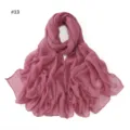Detail shot of the shimmering dusty pink starry voile scarf, showing lightweight texture. - Dark Pink