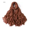 Detailed view of the soft lightweight modal solid color scarf with fringe edges. - #15 Clay