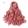 Detail view of the soft modal solid color scarf showing delicate short fringe edges and texture. - #19 Pink
