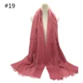 Detailed view of the solid color cotton scarf with fringe, featuring a soft breathable fabric. - Style 19