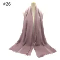 Detailed view of the solid color cotton blend scarf with short tassel fringe and breathable fabric. - Style 26