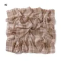 Close-up view of vintage plaid chiffon square scarf, showing soft texture and elegant drape. - Red Gold Flower