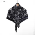 Close-up view of the black and white floral printed pleated chiffon scarf fabric and texture. - 5#