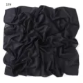 Detailed view of the lightweight black solid color chiffon square scarf, soft and breathable. - Pink Unicorn