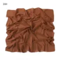 Chiffon square scarf detail, lightweight breathable solid color fabric texture close up. - Dinosaur Silhouette