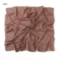 Detail view of a solid color chiffon square scarf, lightweight and breathable fabric. - Black Dinosaur