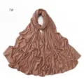 Detailed view of the brown rhinestone embellished stretch mercerized cotton hijab scarf. - Size 7