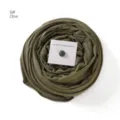 Detail view of olive green mercerized cotton hijab scarf paired with a magnetic pin accessory - Olive Green