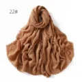 Detailed view of brown crinkled cotton linen scarf showing soft texture and fringe edge. - Brown