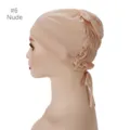 Detailed view of breathable mesh inner cap, elastic adjustable turban with ties in nude color. - Nude