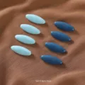 Detailed view of the 8pcs blue plastic hijab pins and anti-exposure scarf clips set. - Group 9 Blue