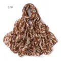 Detailed view of the stylish brown printed chiffon scarf, lightweight and elegant accessory. - Style 57 Navy Leaf/Orange Flower