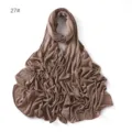Detailed view of the solid color modal jersey hijab scarf in brown, soft fabric texture. - Brown