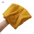 Detail view of the soft solid color jersey modal scarf, showing breathable fabric texture. - Mustard Yellow