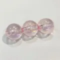 Close-up detail of pink iridescent acrylic round beads with straight holes for DIY jewelry. - 16mm Approx 220 Beads per Catty / Pink