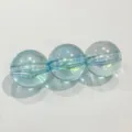 Close-up detail of transparent light blue AB iridescent round acrylic beads for DIY crafts. - 16mm Approx 220 Beads per Catty / Lake Blue