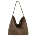 Detailed view of the brown suede shoulder bag, soft slouchy hobo texture and stitching. - Green