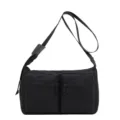 Black nylon crossbody shoulder bag with dual front zip pockets for daily commute. - 31x10x21cm / Black