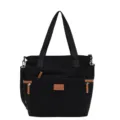 Black corduroy tote bag with brown leather trim, casual shoulder and crossbody style. - Black