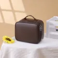 Bruine lederen cosmetische tas, draagbare reismake-uporganizer met dubbele ritssluiting. - Bruin