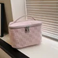 Pink checkered cosmetic bag with handle and double zipper for daily makeup storage and travel use. - Pink