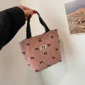 Roze corduroy shopper met zwarte strikjes, retro handtas en draagbare lunchtas voor dagelijks. - Roze