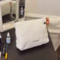 White fluffy cosmetic bag, plush makeup pouch with zipper and handle for daily portable use. - Clutch Style / White