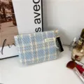 Blue tweed cosmetic bag with pearl charm, stylish plaid makeup pouch for women and travel use. - Light Blue
