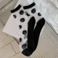 Chaussettes mi-hautes transparentes pour femmes joli visage souriant noir et blanc - Taille Unique (Emballage Individuel) / Sourire Noir