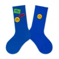 Blue crew socks for kids featuring embroidered smiley face and letter patches, autumn style. - Blue